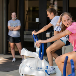 students practicing on stationary bikes