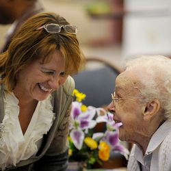 woman speaking with elderly woman