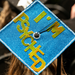 a graduation cap with the words "I'm psyched"