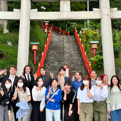 students standing in front of a Japanese temple