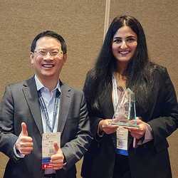 Brian Chen and Zainab Yaseen pose with the award.