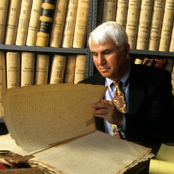 professor in front of books