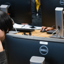 two students looking at their computers
