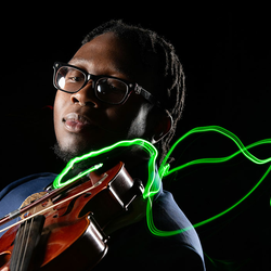 student playing violin with neon bow