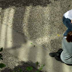 Overhead view of two students working on creative group project together