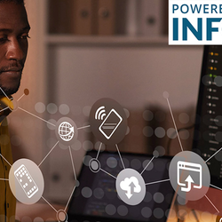 Man working on a computer surrounded by security icons, with "Powered by Infosec" logo.