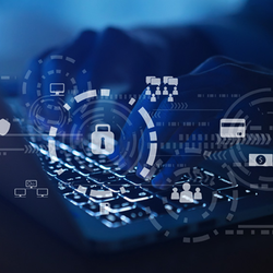 Hands typing on a keyboard with digital security icons overlay.