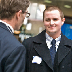 a student talking to a potential employer