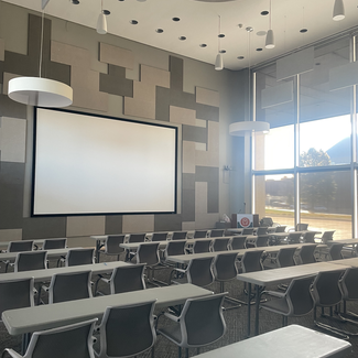 giant screen and chairs and tables