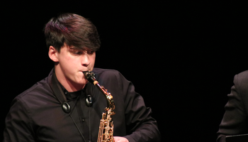 Jazz performer playing the saxophone