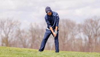 Sacha Lamraski golfing in blue UIS outfit
