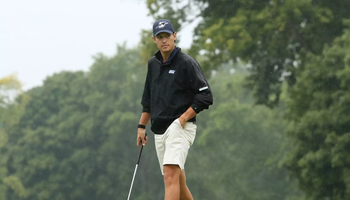 Julien Babineau golfing in rain