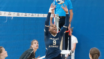 Erica Sledge setting the ball