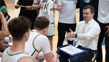 Coach Matt Brock speaking to the team