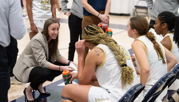 Olivia Lett coaching team during timeout