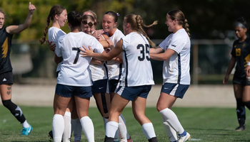 Women's soccer team celebrates a goal