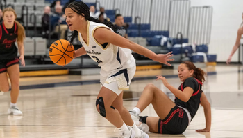 Kayla Rice coming off a steal in basketball game