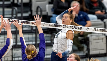 Alexis Schwartz goes up for a kill in volleyball match