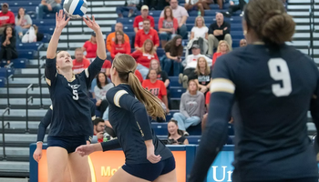 Anna Laincz sets Kendall Johnson up for an attack