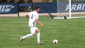 Lennard Borgs playing soccer at UIS in white uniform