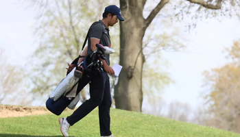 Sahachat "Chevy" Noosong walking the golf course