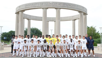 2026 UIS Men's Soccer team photo of student-athletes and coaches in front of the UIS Colonnade