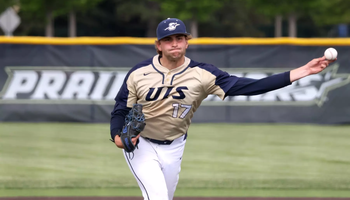 Graham Kasey pitching for UIS baseball in gold jersey