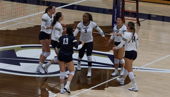 UIS volleyball team on court