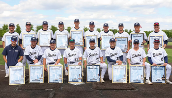 UIS baseball senior class pictured on field in uniform with their senior gifts