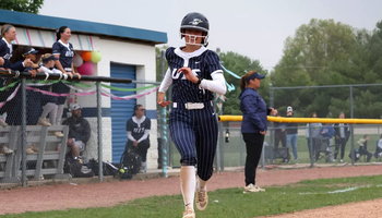 Jaden Watts running home in a softball game