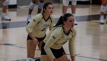 Bella Hodges and Makenna Cox await serve
