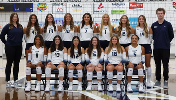 2026 UIS Volleyball team photo on court with coaches