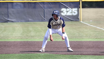 Chris Suchoski base running in golf UIS baseball uniform