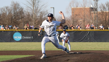 Graham Kasey pitching in white UIS uniform