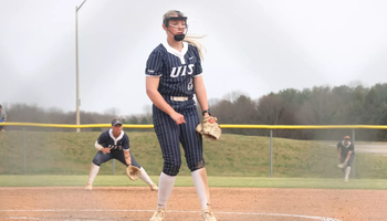 Calista Stahlhut  pitching in blue UIS uniform