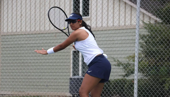 Alisha Deogaonkar playing tennis at UIS