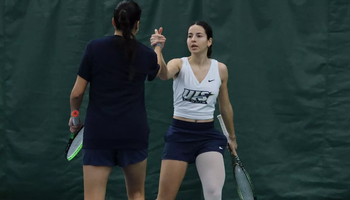 Carmen Llopis Fabra and Cristine Mendoza in doubles play