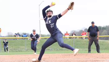 Calista Stahlhut pitching in blue UIS softball uniform