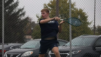 Luke Pennington playing tennis for UIS