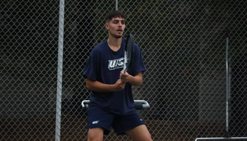 Miran Todorovic playing tennis at UIS