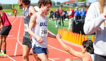 Joey Karlesky helps up teammate Matt Padilla after race