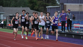 Chase Cooley in a pack of runners in 1500 meter outdoor track race