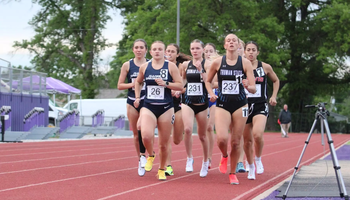 runners in a pack racing outdoor track at SBU