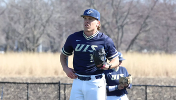 Adam Wibbenmeyer pitching for UIS baseball in blue jersey