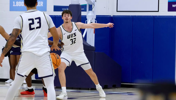 Alex Stell playing basketball at UIS
