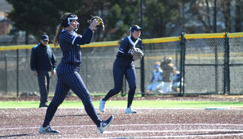 Alexis Carroll pitching in blue UIS uniform