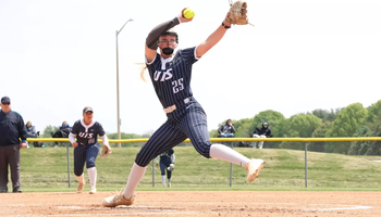 Calista Stahlhut pitching in blue UIS uniform