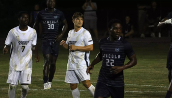 Carter Downen and Gentil Selemani on soccer field