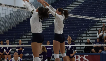 Makenna Cox and Lexie Vick block at the net