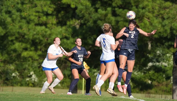 Kalli Drexler heading a soccer ball